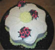 Popular lady bugs on a flower cake